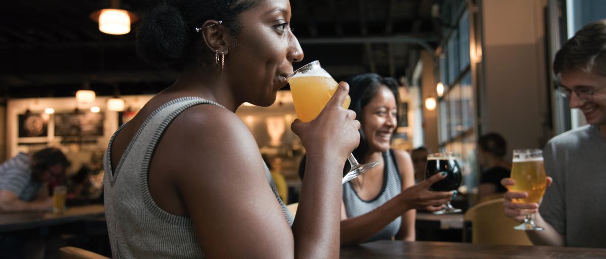 Woman drinking at a bar