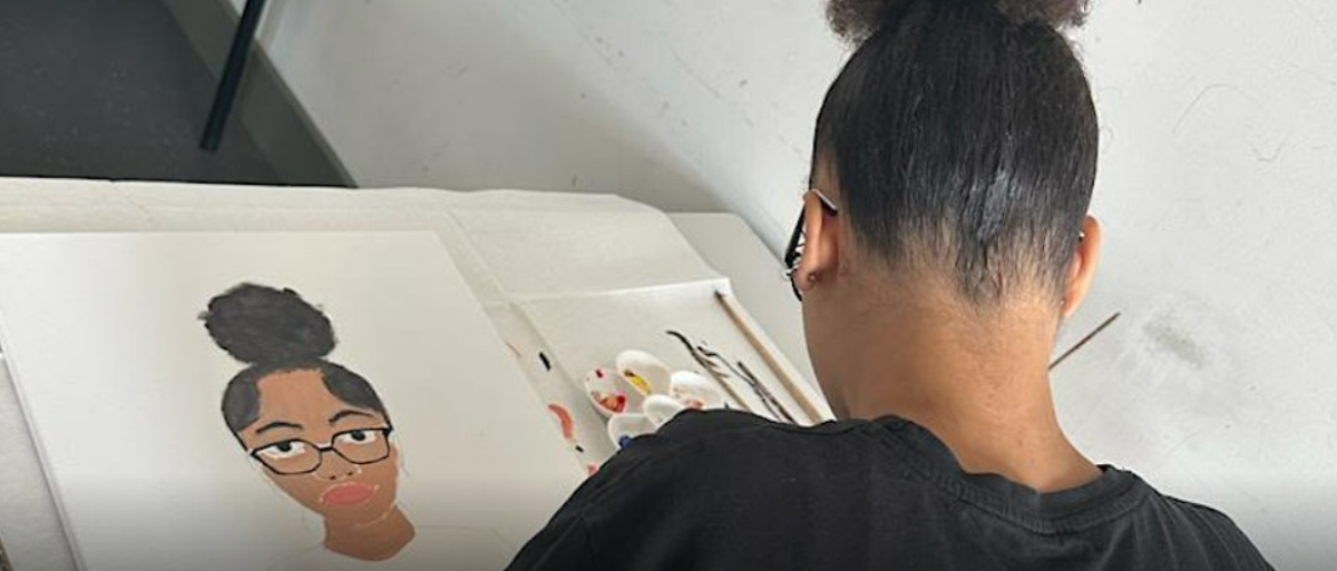 Young girl drawing a self-portrait