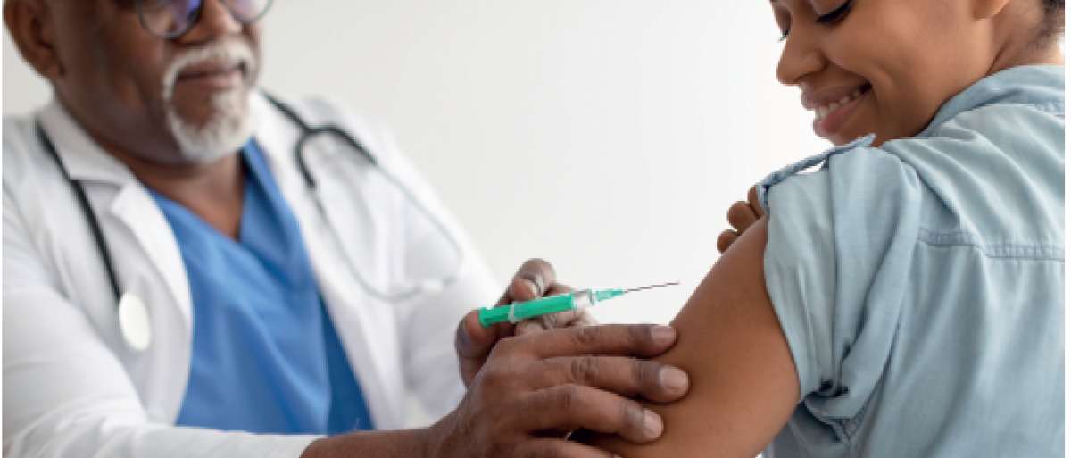 Woman getting vaccinated by a male doctor