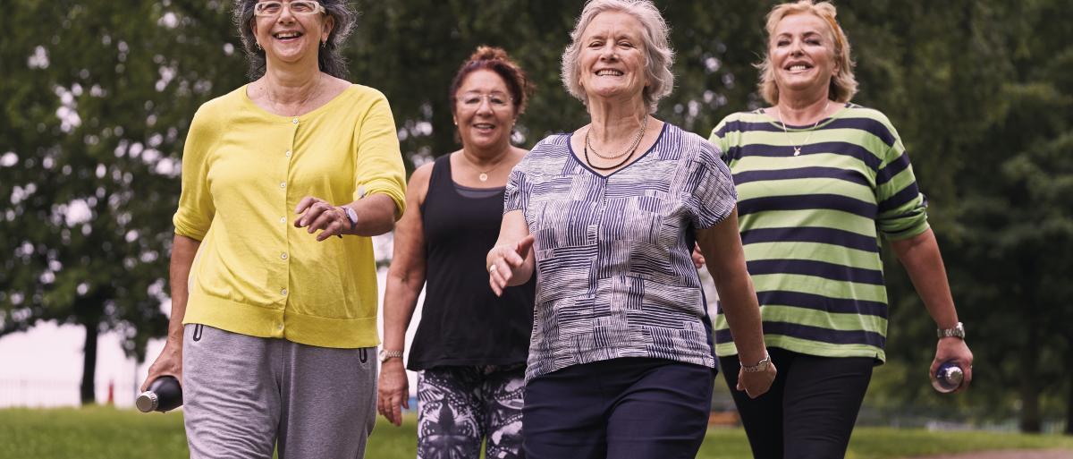 A group of elderly women walking 