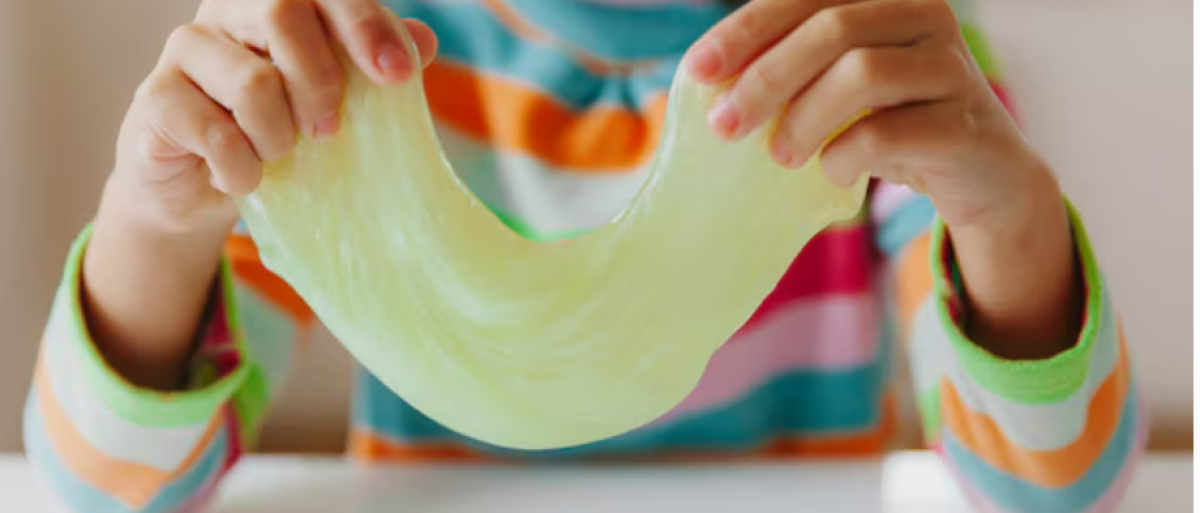 A child holding slime