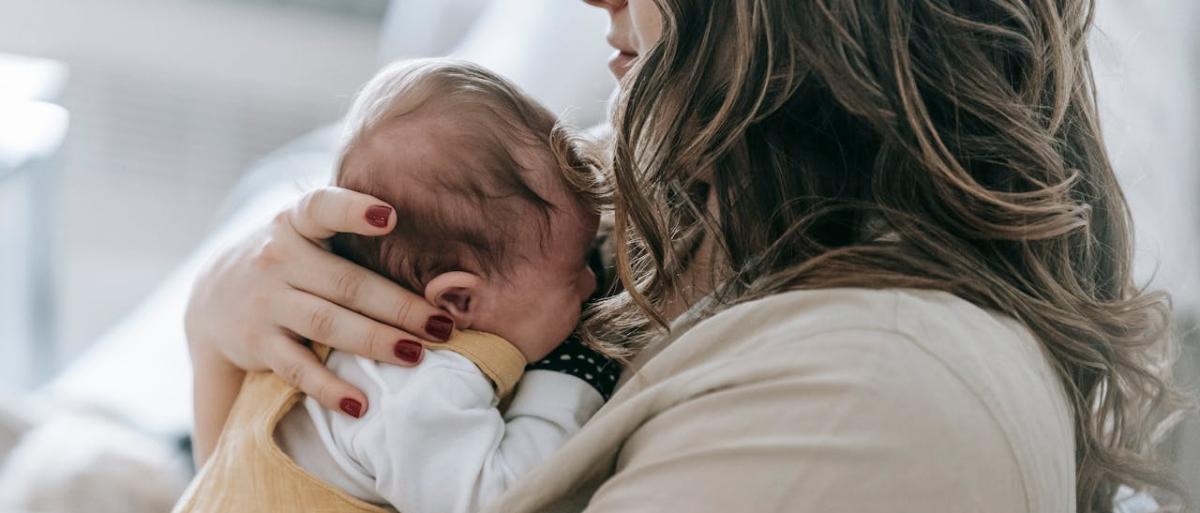 A mother holding a child