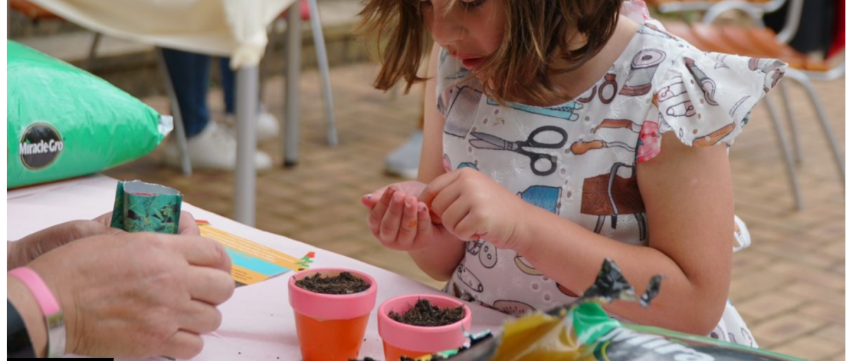 A child holding soil