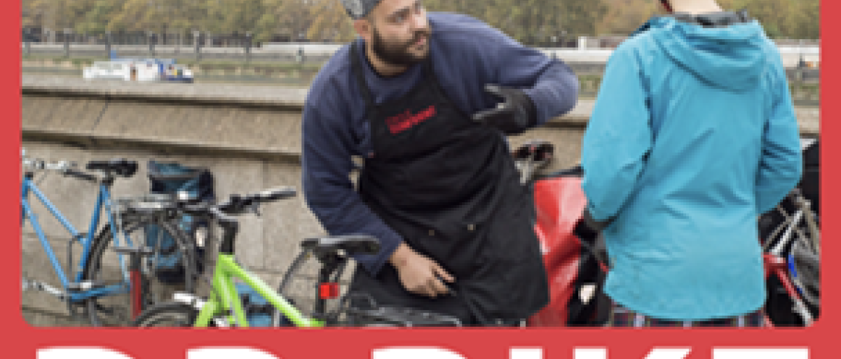 2 people in front of bicycles