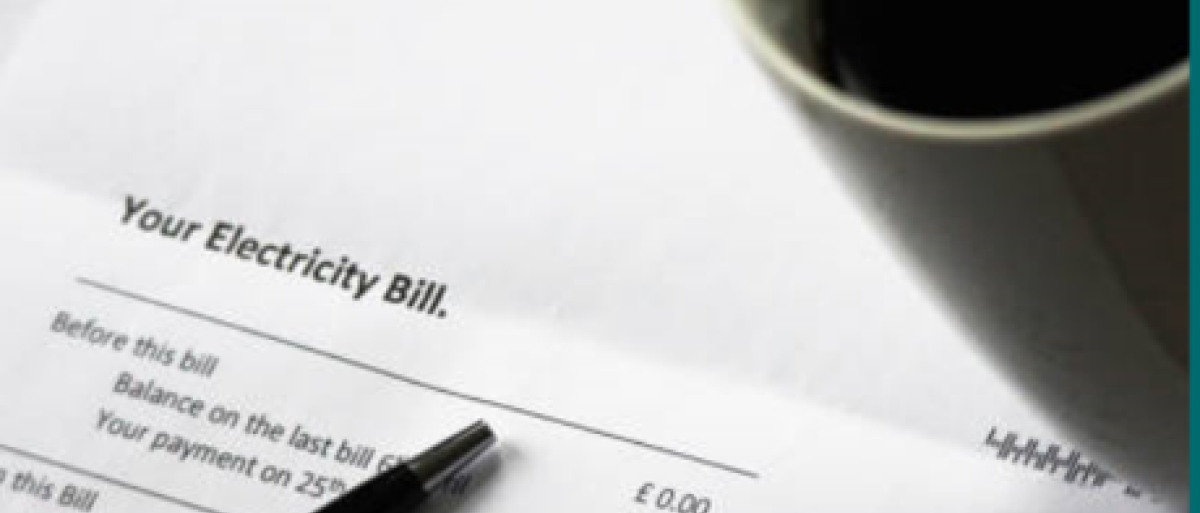 Energy bill with a pen on it 