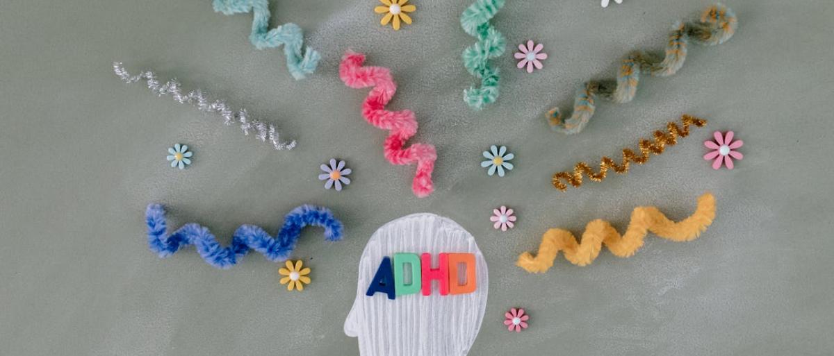 ADHD written with wool in a skull like shape