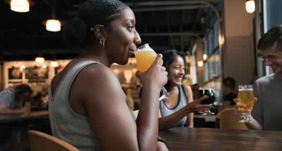 Woman drinking at a bar