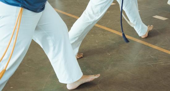 Two young people doing martial arts