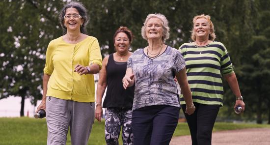 A group of elderly women walking 