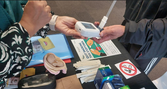 Someone holding a carbonmonxide monitor